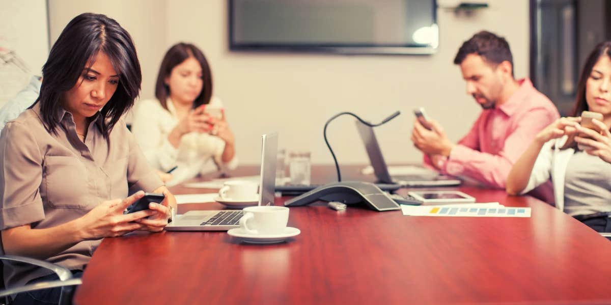 coworkers distracted by their phones