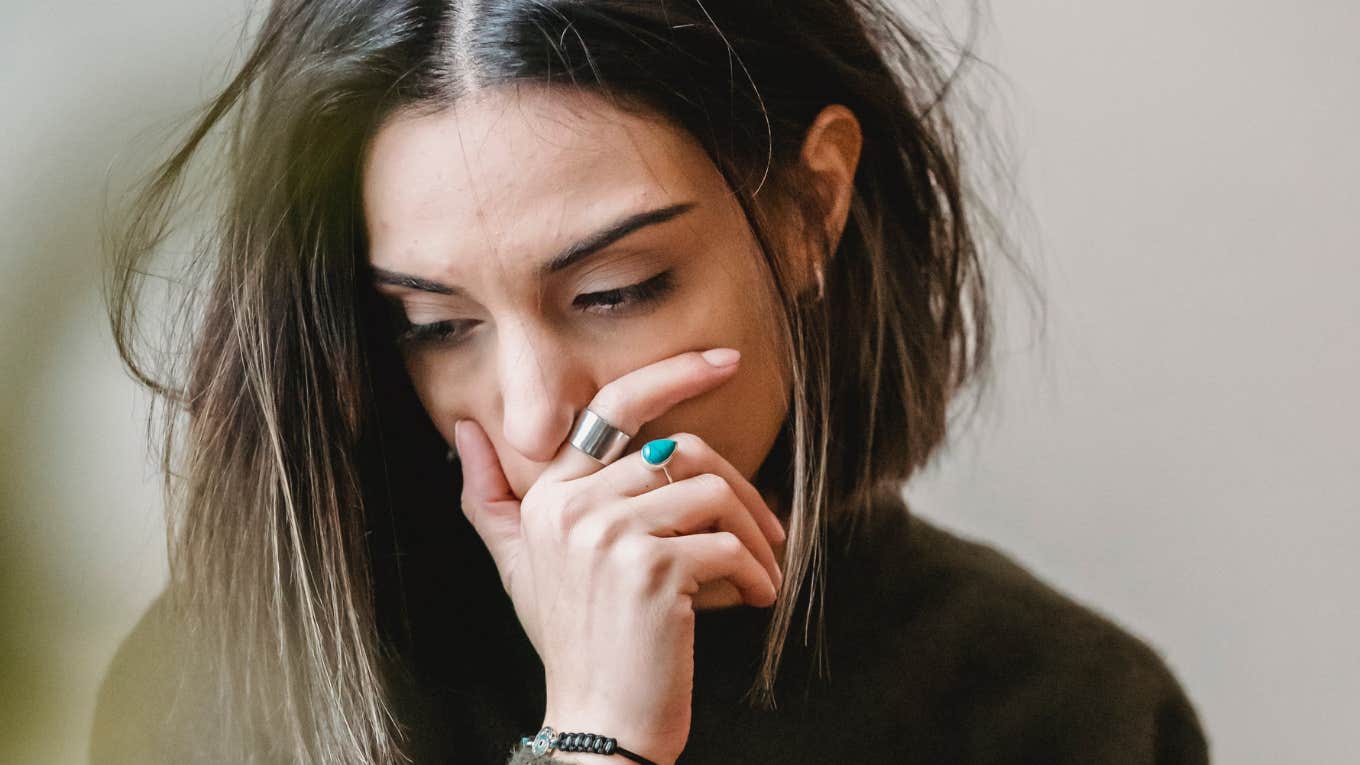6 Painfully Blunt Signs Your Ex Is Over You Woman realizing she must move on from her relationship