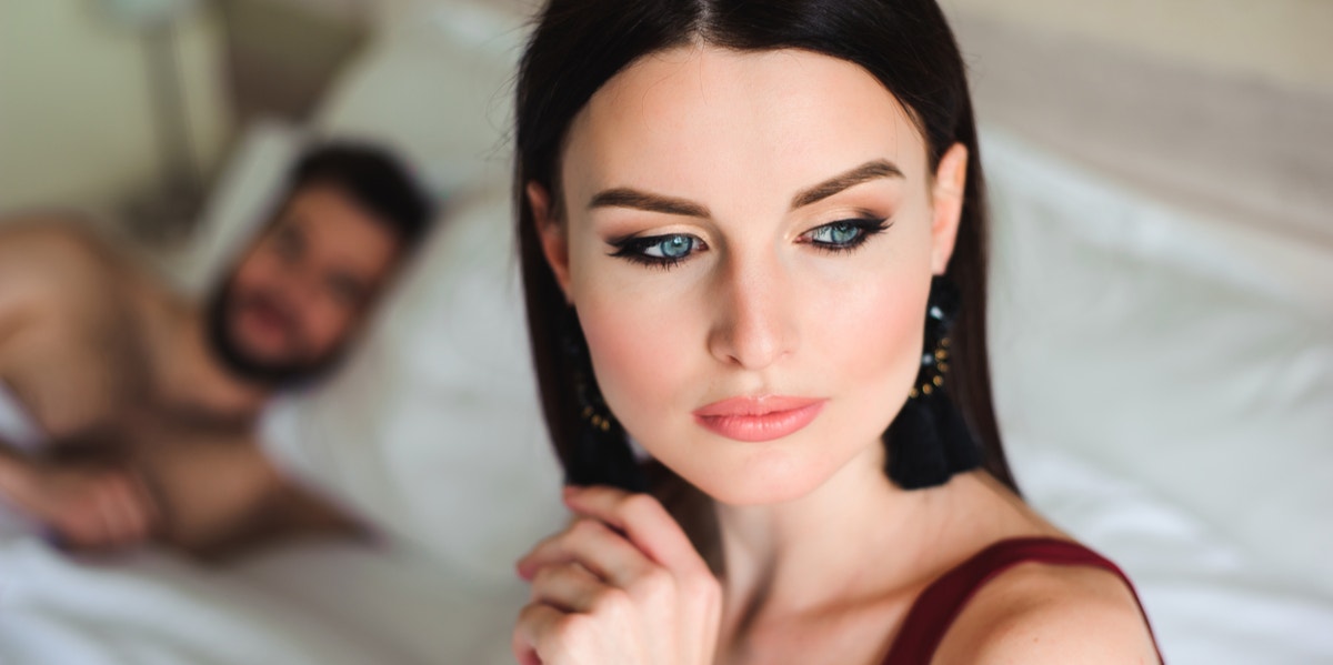 3 Subtle Signs You're Cheating (Without Even Realizing It) woman and man in bed