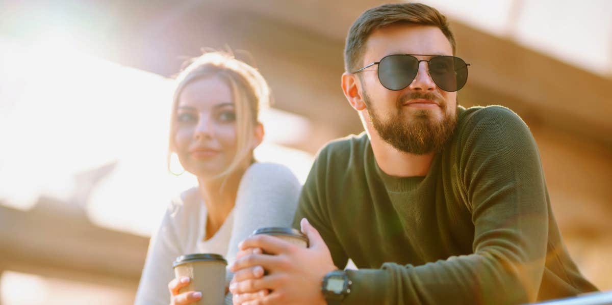 man ignoring woman on date