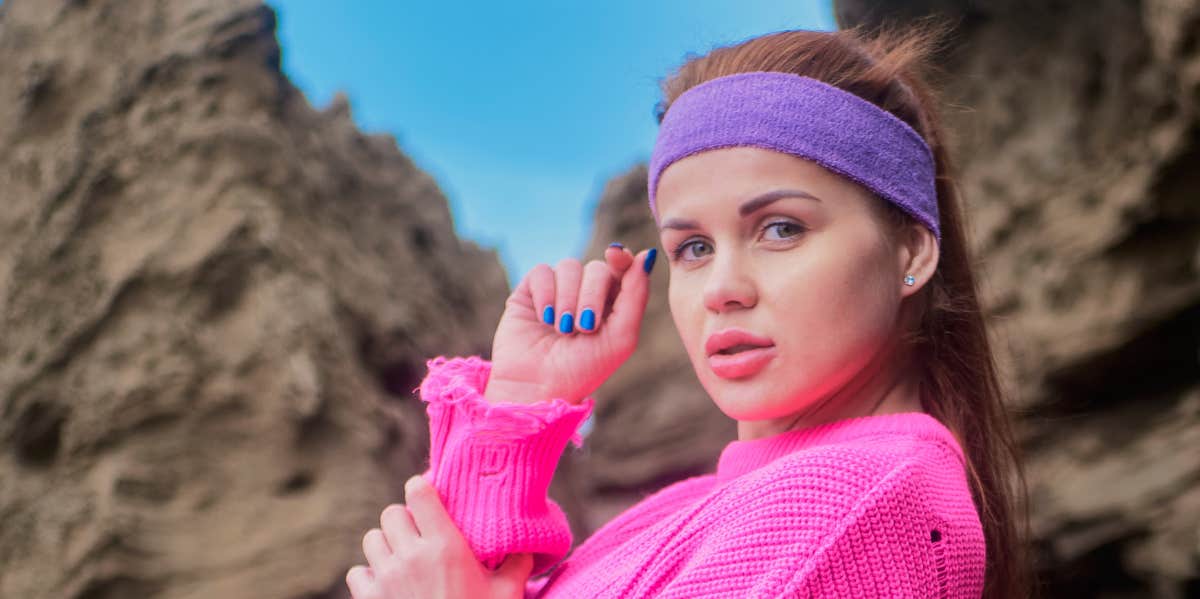 9 Signs You're A Drama Queen woman in 80s workout gear