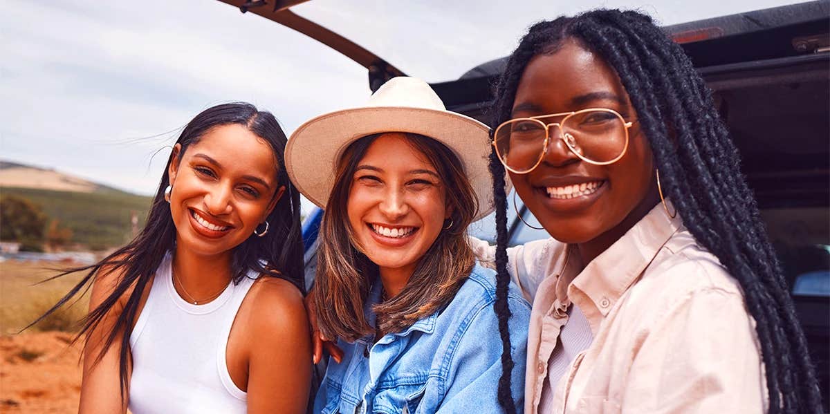 three girls smiling for photo