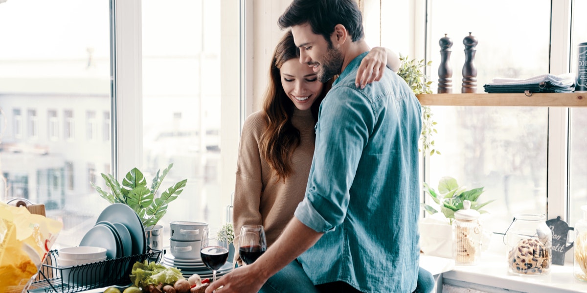 man and woman in kitchen