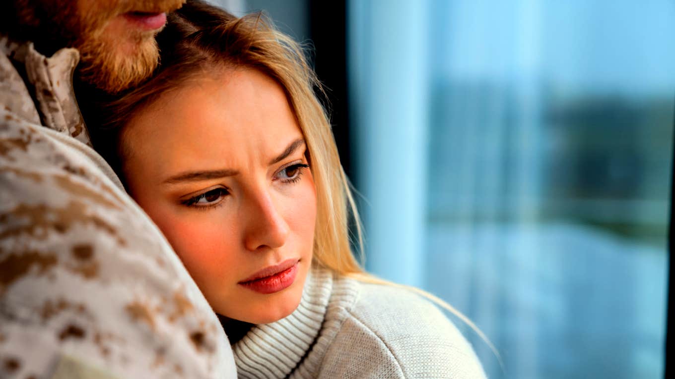 woman hugging man feeling unsure if she is still in love