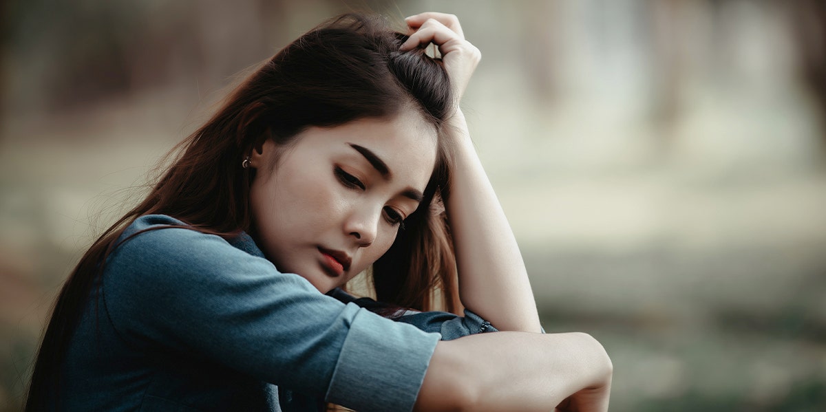 If These 9 Things Sound Familiar, You're Settling In Your Relationship woman thinking alone
