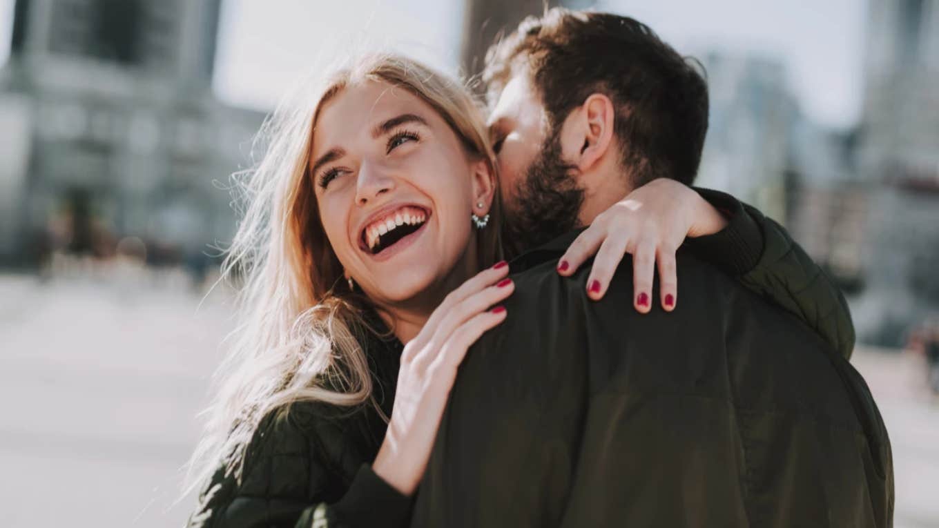 man kissing woman lovingly