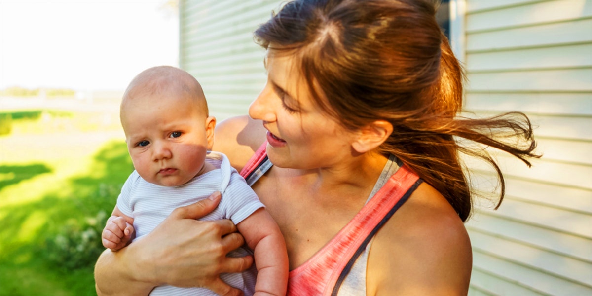 single mom holding baby