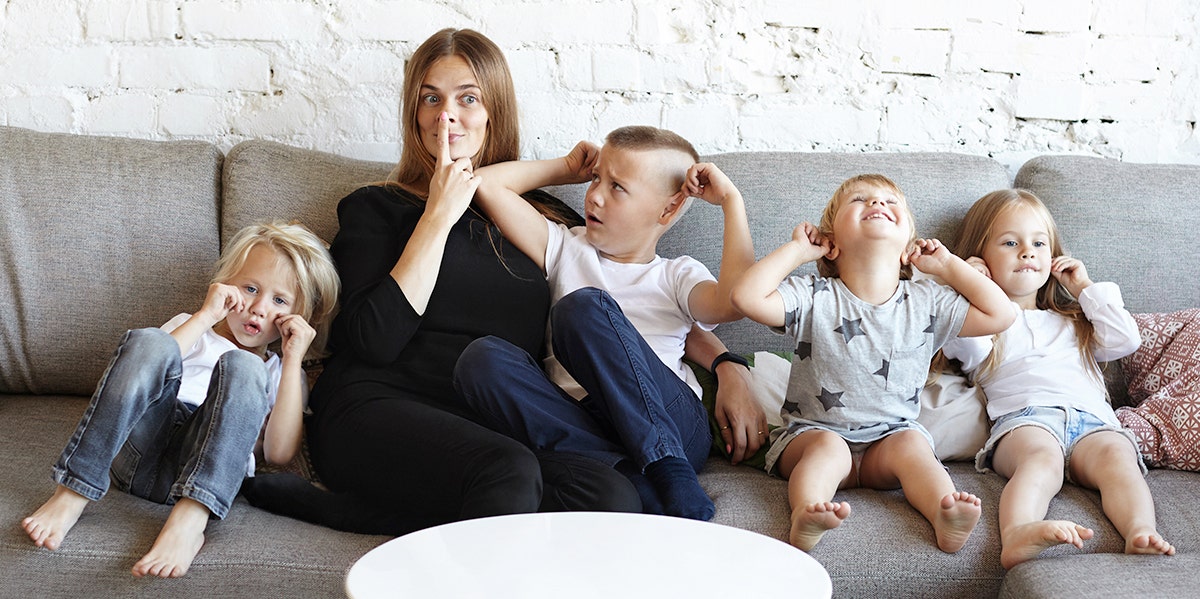 mom with kids on bed