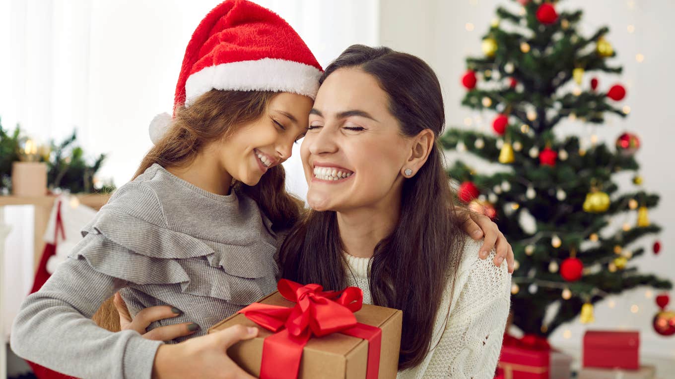 Mother receives gifts from her loving child on Xmas Day