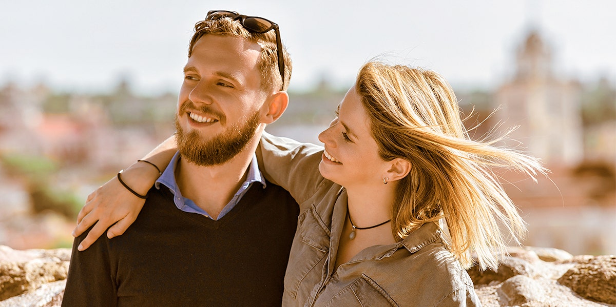 woman with arm around man