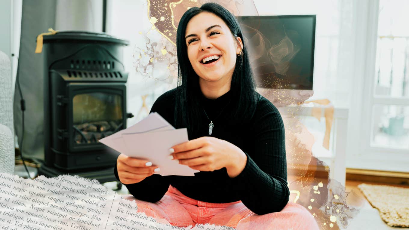 Woman holding papers in her hand, smiling confidently