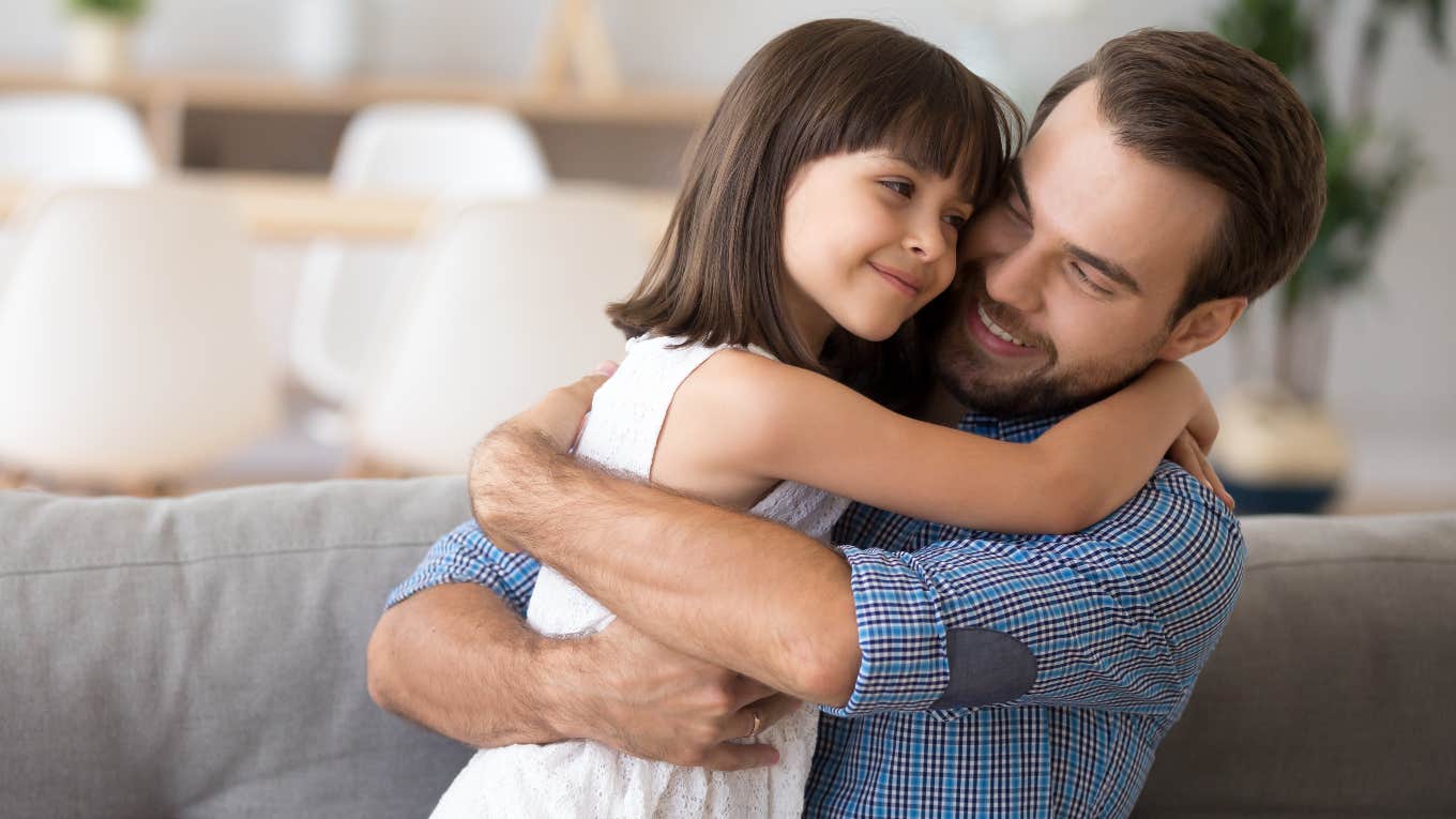 girl and her foster dad hugging