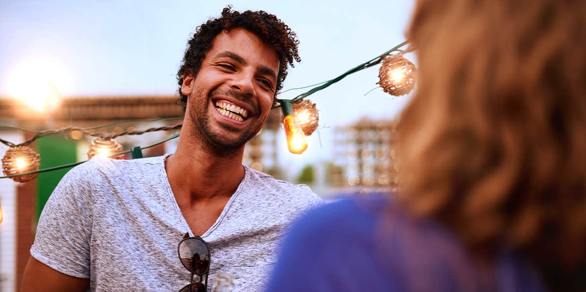 Experts Reveal 3 Little Things Men Wish Women Would Do To Boost Their Confidence guy smiling at woman flirting