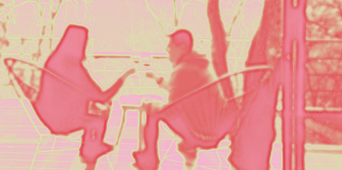The Not-So-Silent Relationship Killer That Creeps Up On You man and woman sitting down shadow