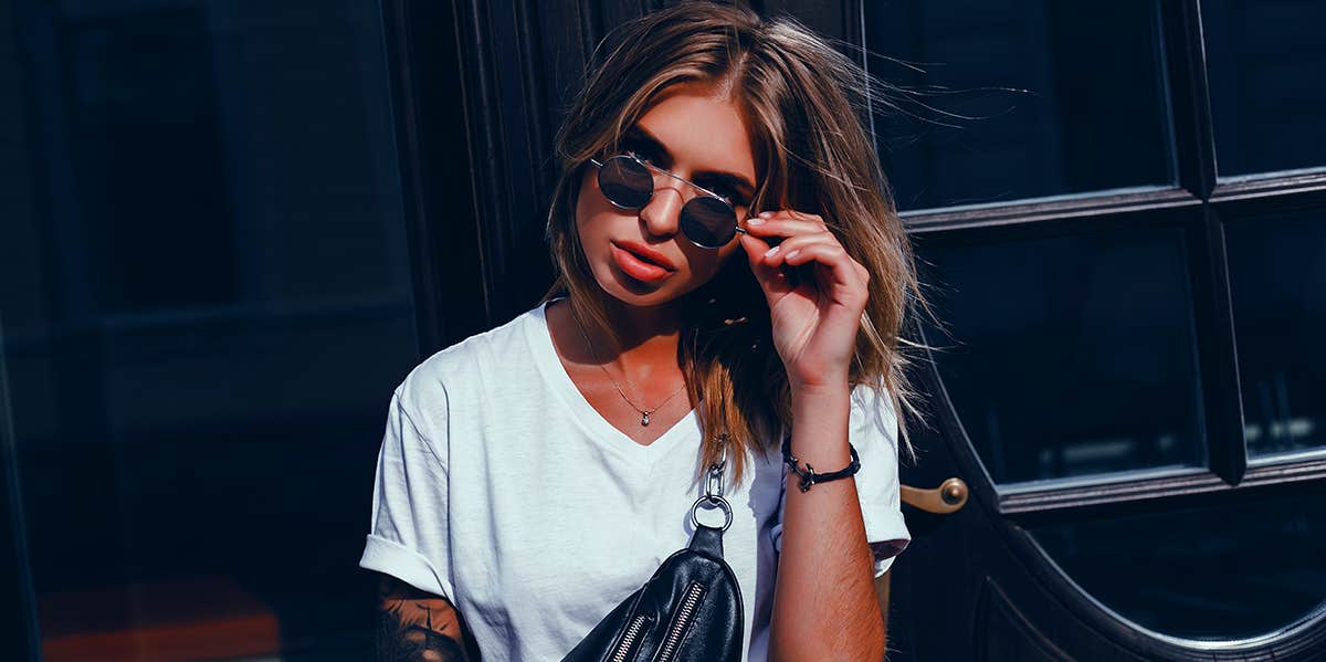 4 Rare Psychological Skills Only True Masters Of The Universe Know woman pulling sunglasses down