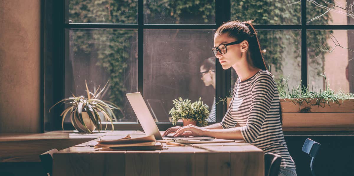 The Fewer Friends You Have, The Smarter You Are, Says Science woman on laptop