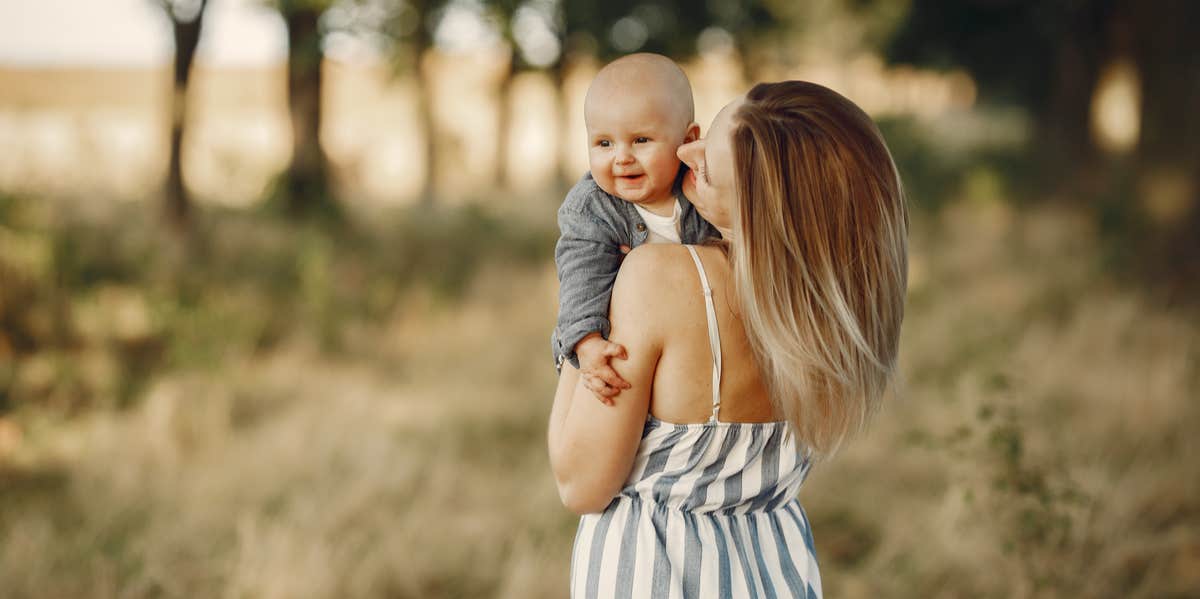 mom holding baby