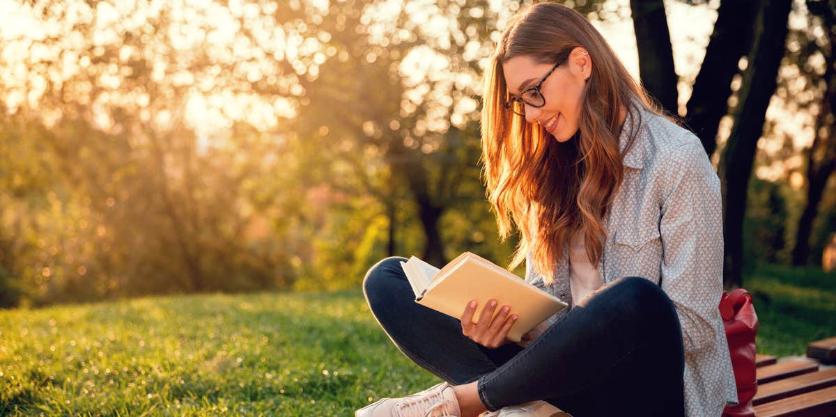 The Smartest People Possess These 4 Traits Of Emotional Intelligence woman reading outdoors