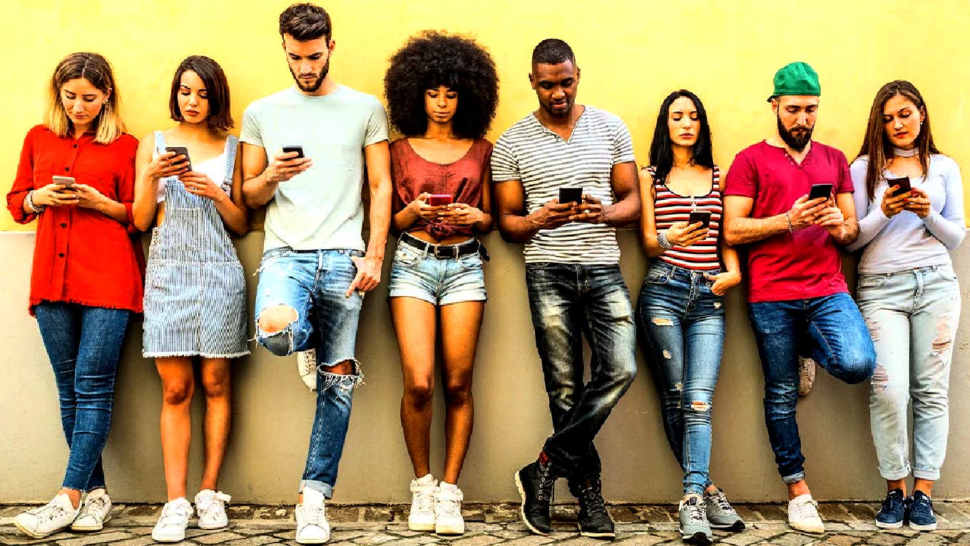 The Lie About Social Media Addiction That Fooled 82 Million People crowd of people on phones