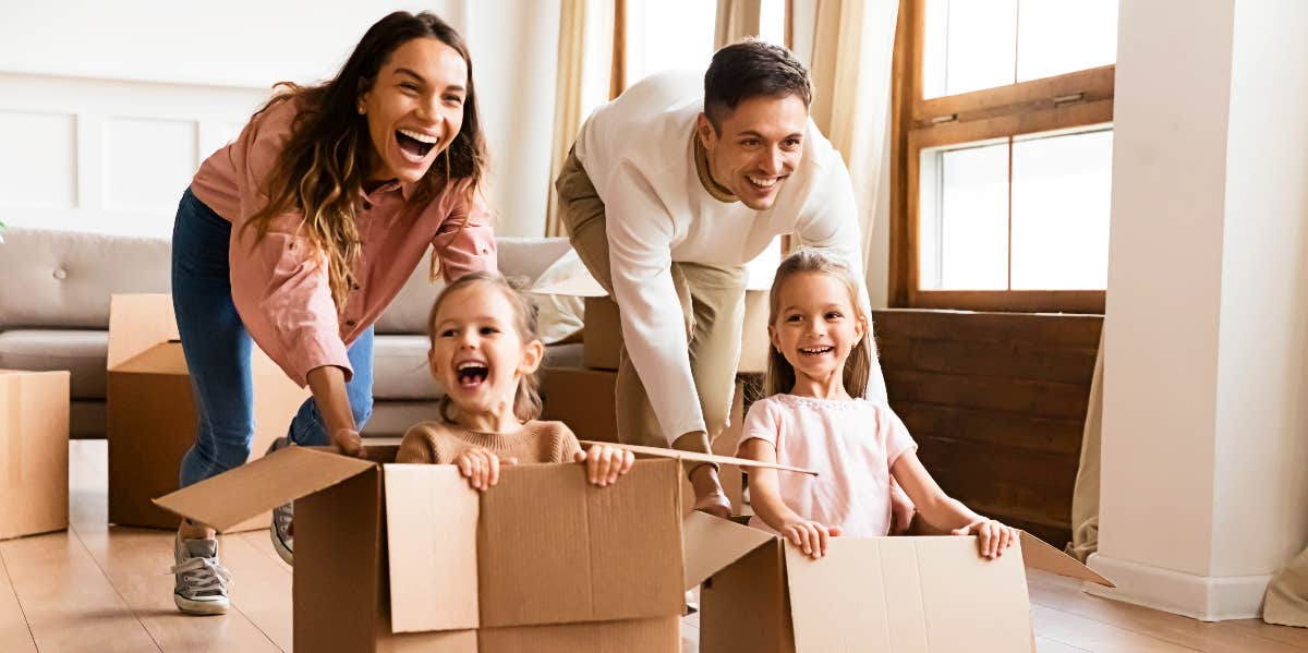 Family plays with boxes