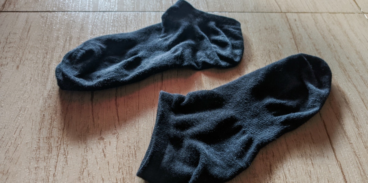 2 black socks on floor