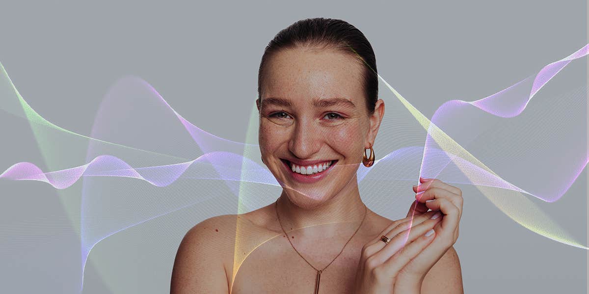 woman smiling with colorful soundwaves