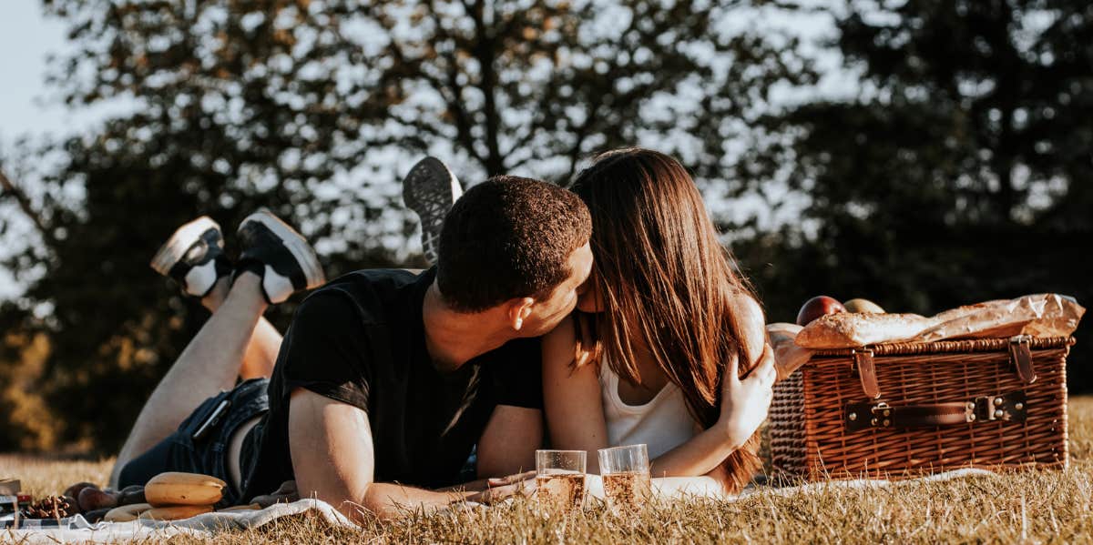 How Often Married Couples Kiss, According To Research couple kissing on picnic date