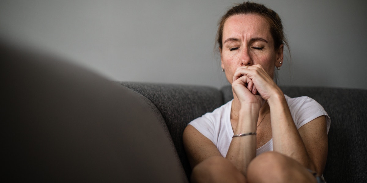 a woman sitting in sadness