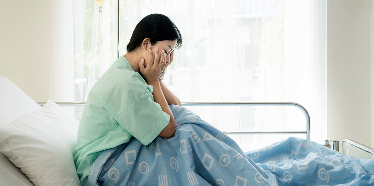 What My Son's Death Taught Me About Men woman grieving in bed