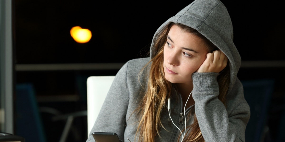 sad woman listening to songs for the dumped