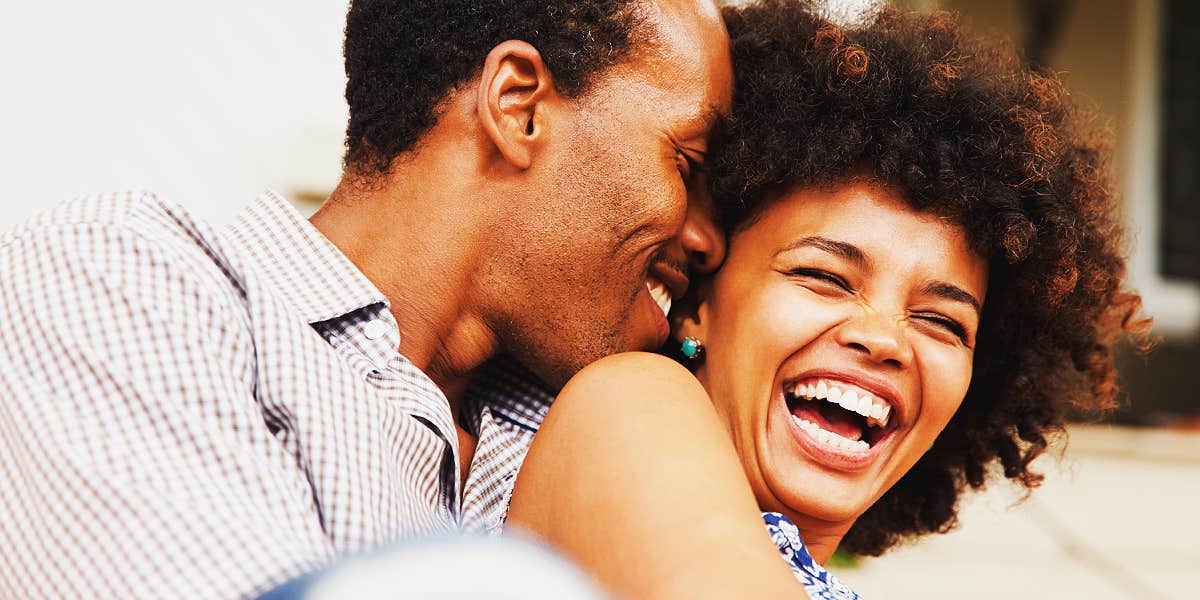 Couple laughing and nuzzling 