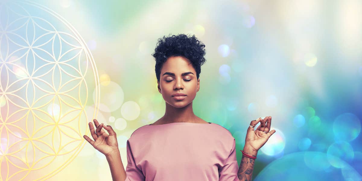 woman meditating with eyes closed