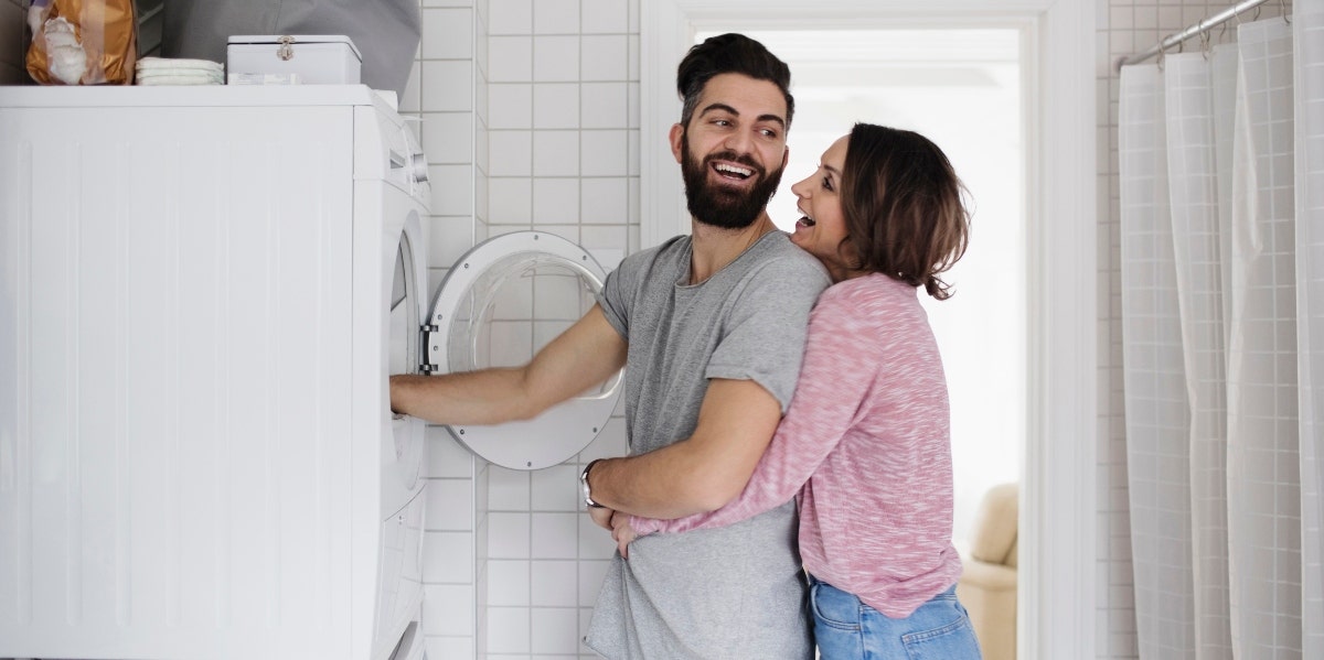 man and woman doing laundry