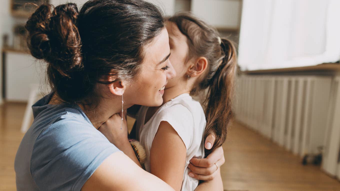 Stay-At-Home Mom Says She's Raising Her Daughter To Become A Traditional Wife mom hugging daughter