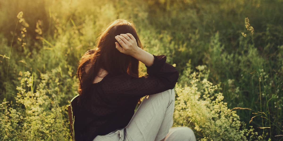 woman sitting thinking