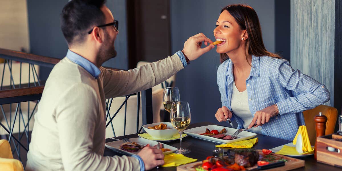 couple having steak dinner on Steak and Blowjob Day