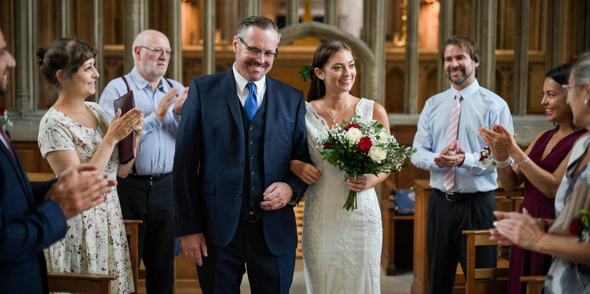 Father walking daughter down aisle