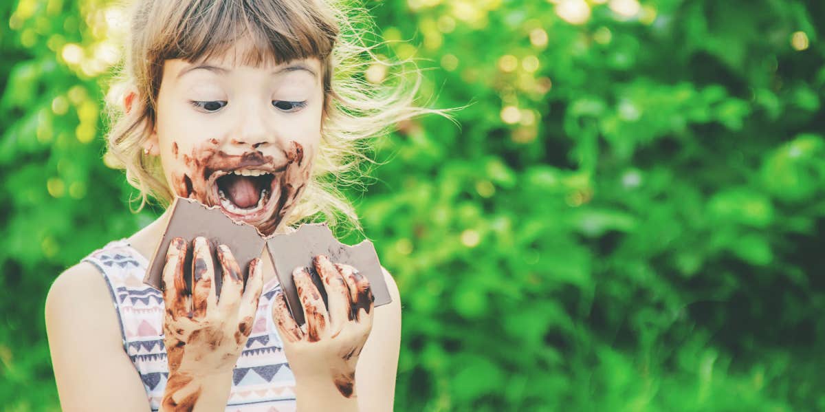 Girl eating chocolate bar