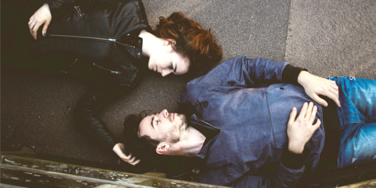 Stop Looking For 'The One' When There's More Than Just One Out There couple laying parallel to each other