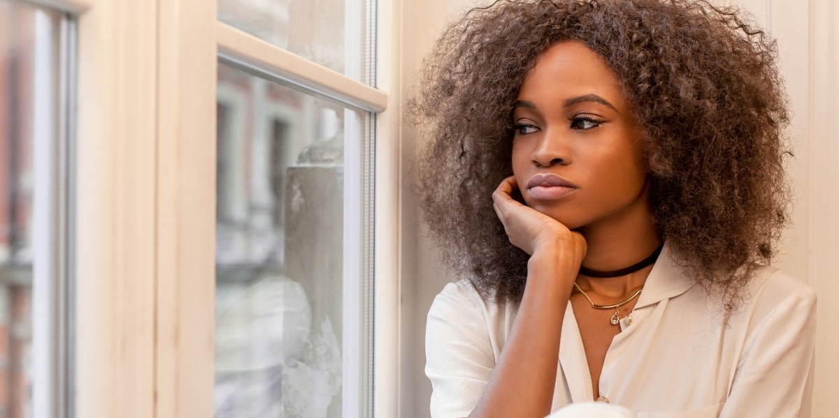 woman looking out the window