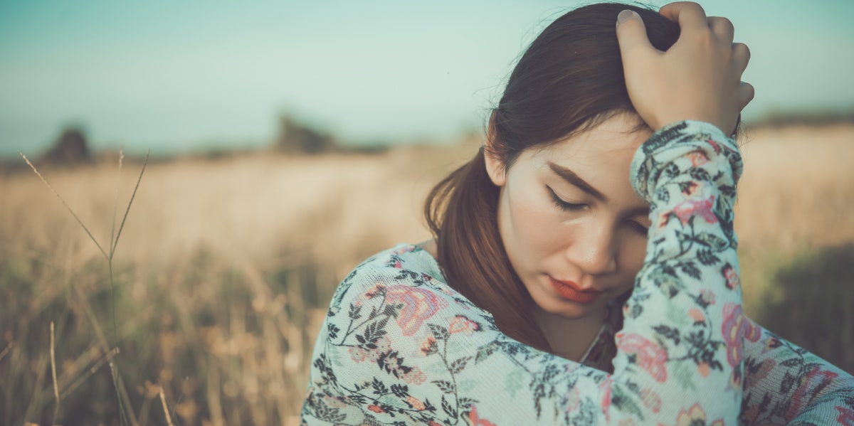 sad woman head in hands