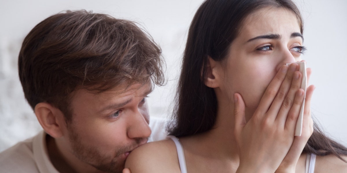 How To Get Out Of Victim Mentality In A Toxic Relationship woman crying and being held by man