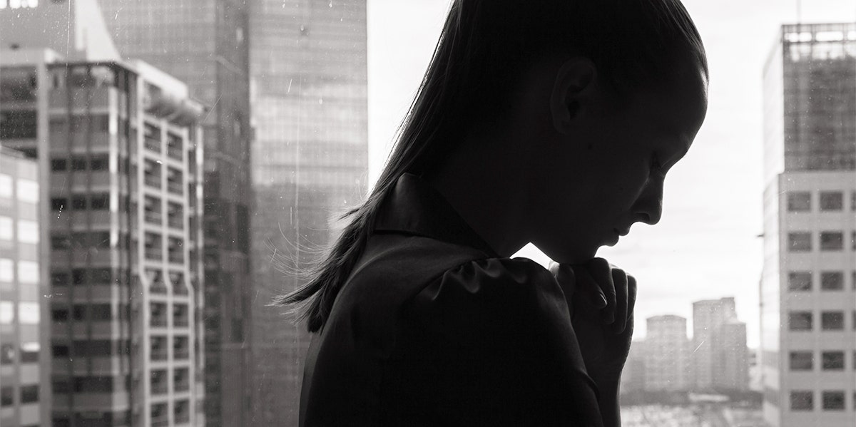 woman's silhouette by window