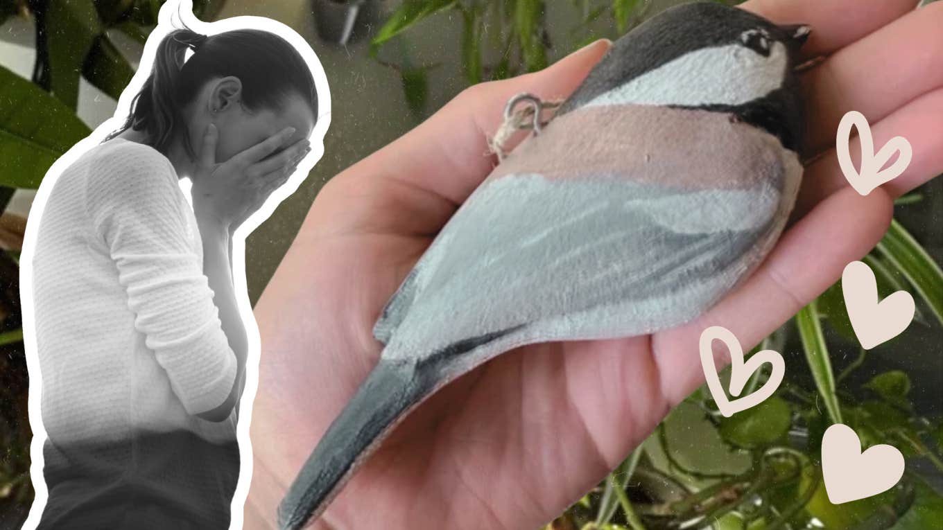 Woman holding a decorative bird in remembrance 