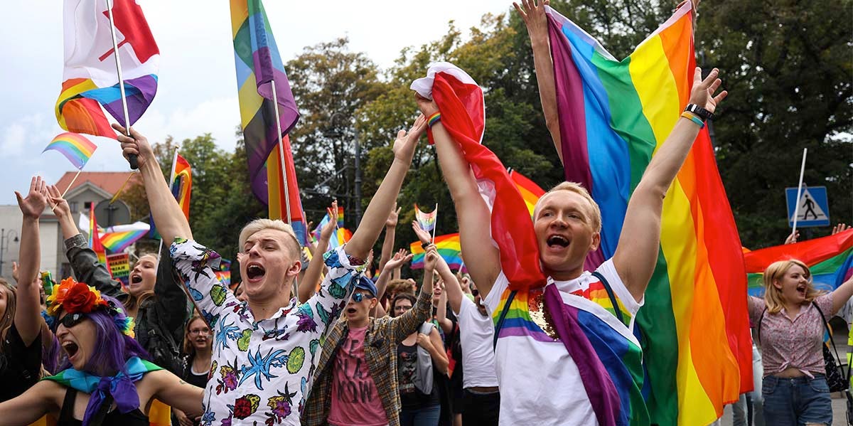 pride parade photo, young people with pride flags