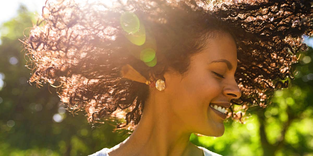 Strength and Resilience Care-free woman twirls hair