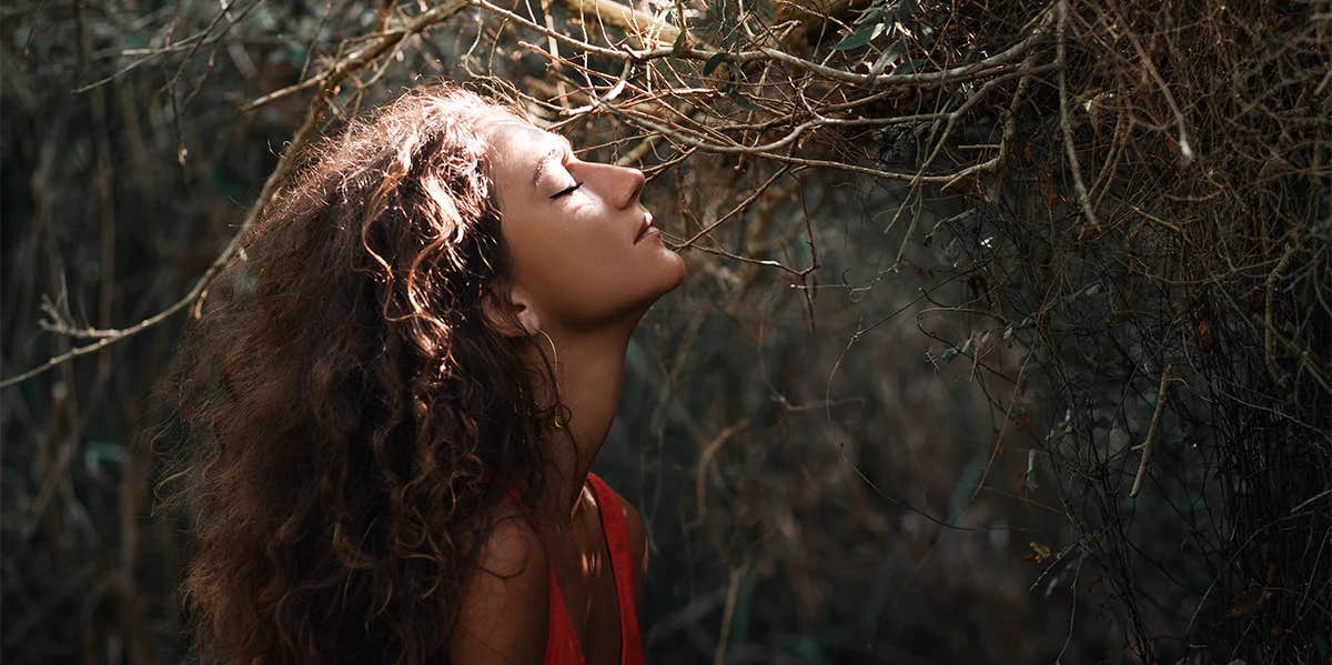 woman in the woods eyes closed