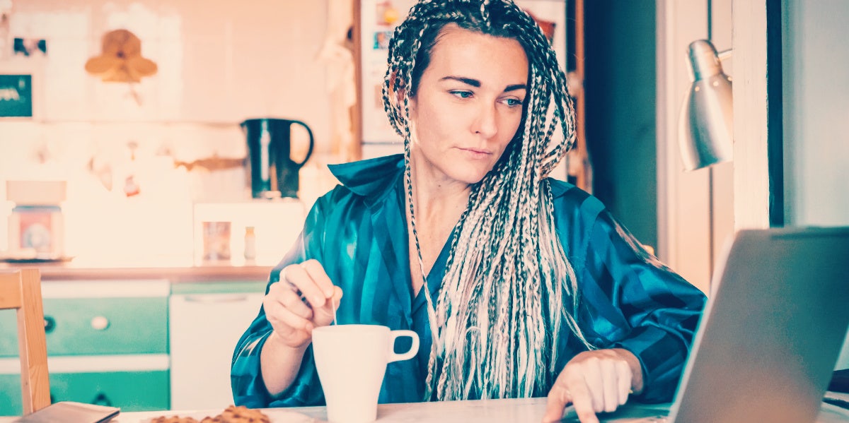 woman stirring coffee as part of her daily routine