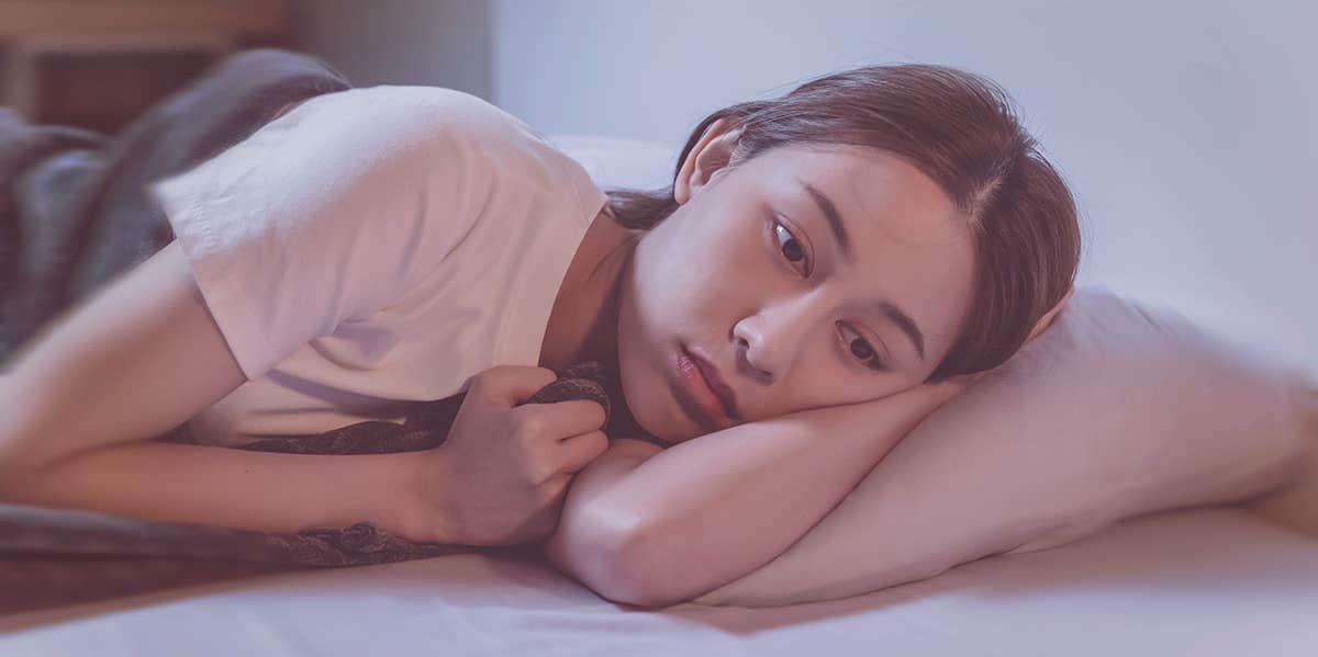 Read This If You’re Trying And Struggling To Overcome Emotional Trauma upset woman laying in bed
