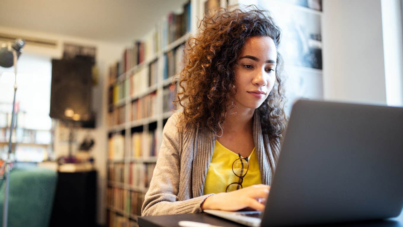 college student reading email on computer